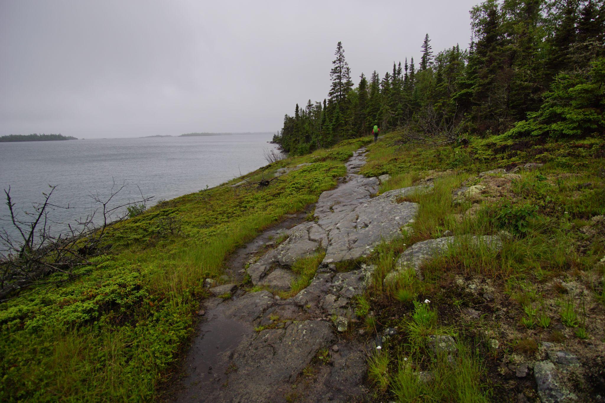 The trail changed as the northwoods were intercepted by alpine. The sky brightened as we bounded over rocks. To my left, the harbor, the outer islands, and Superior. To my right, pines.